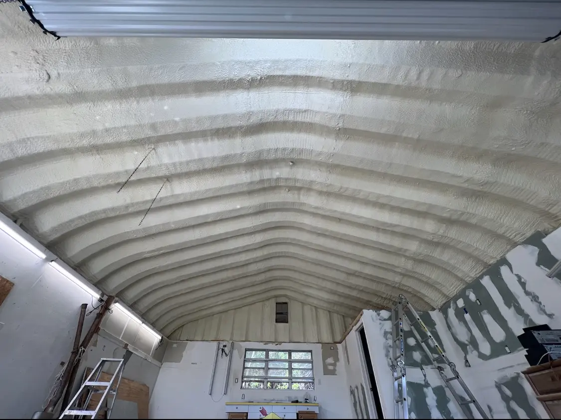 Spray polyurethane foam applied to the underside of a metal roof deck in Huntingburg